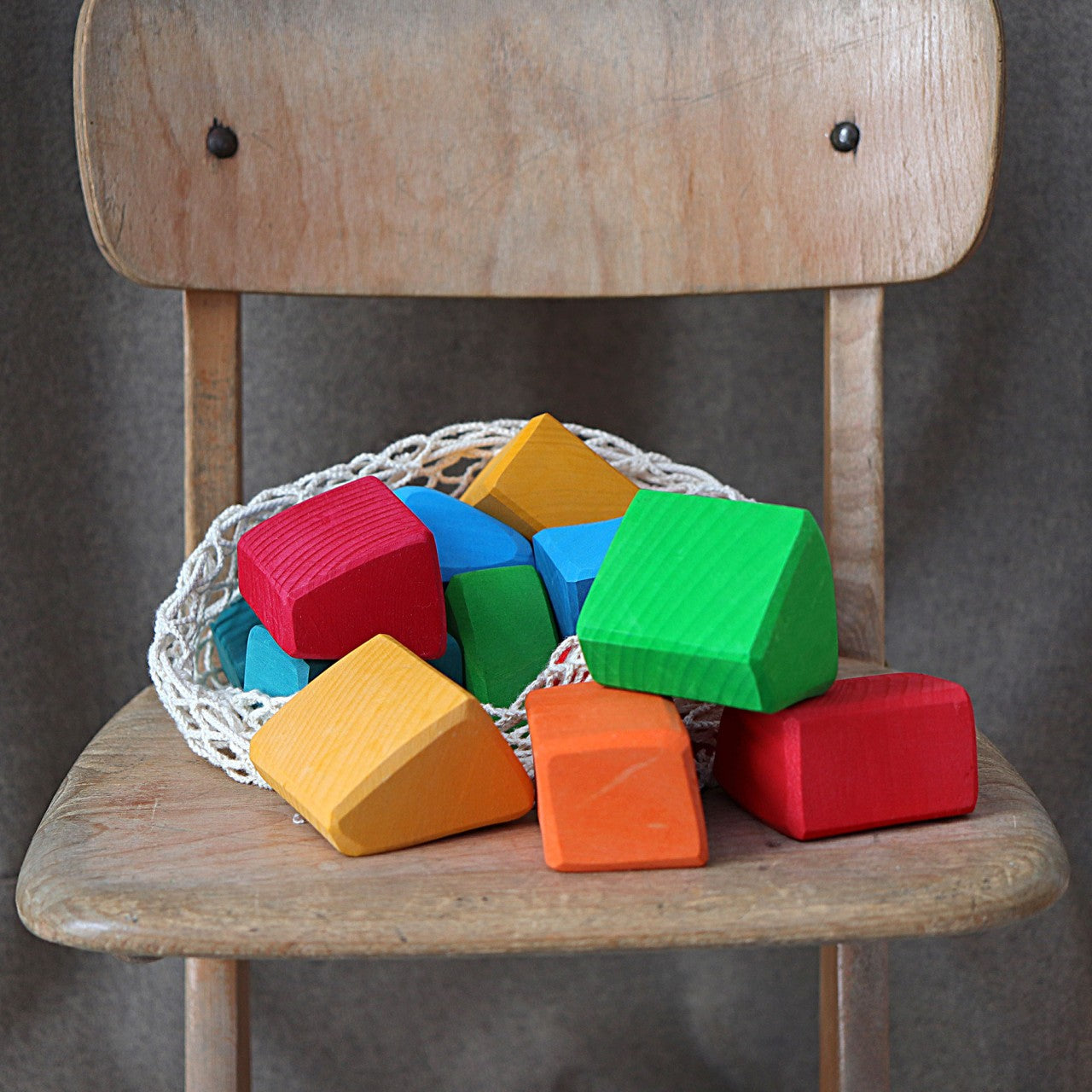 a wooden chair with colorful blocks on it