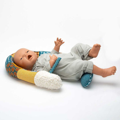 a baby doll in a baby bed